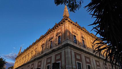 General Archive of the Indies in Seville, Spain, during golden hour with blue sky