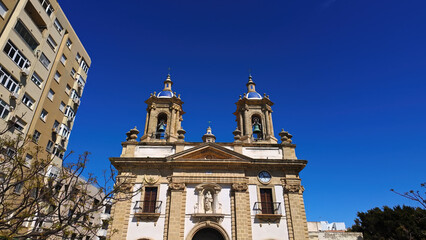 Oratorio de la Santa Cueva church rising in Cadiz, Spain, under blue sky