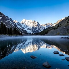 lake reflecting jagged snow-covered peaks with drifting 