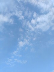 Obraz premium Azure Sky with Fleeting Clouds. A clear blue sky with a few wispy clouds, soft lighting, high - resolution 