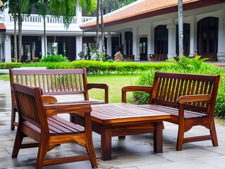 Obraz premium Relaxing Wooden Patio Furniture Set in Lush Garden