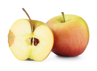 Whole and cut overripe apples isolated on white