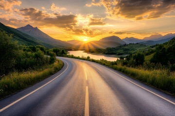 Long empty road leads away towards a dazzling colorful sunset over the open countryside