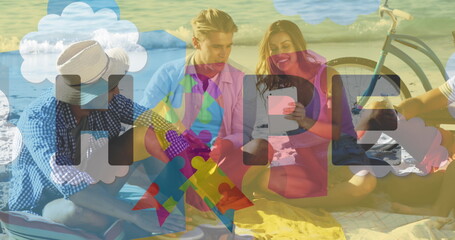 Image of colourful puzzle pieces and autism text over happy friends using tablet