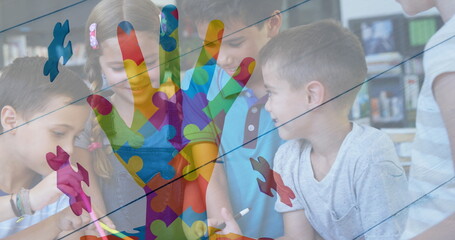 Image of colourful puzzle pieces and hand over school children using tablets
