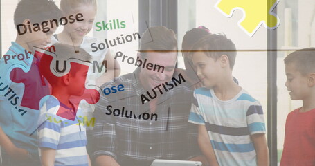 Image of colourful puzzle pieces and autism text over school children with male teacher