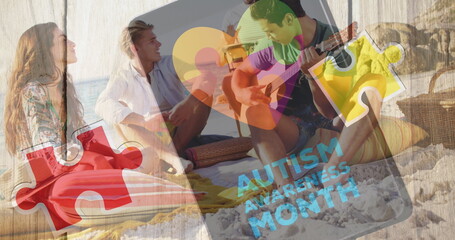 Image of colourful puzzle pieces heart and autism text over happy friends at summer beach party