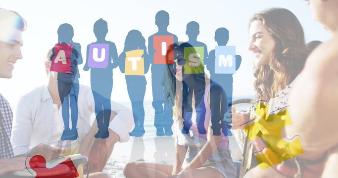Image of colourful puzzle pieces and autism text over happy friends at summer beach party