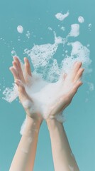 Fototapeta premium Two Hands Catching White Soap Suds Against Light Blue Background Cleanliness Concept