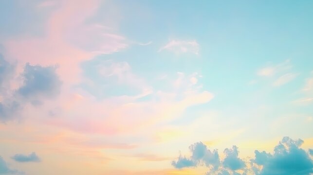 Pastel hues paint a soft, dreamy sky filled with clouds.
