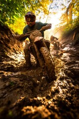 Motocross Rider Splashing Through Mud in a Forest