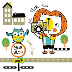 Cartoon lion taking a photo with a camera, owl at a bus stop, park scene
