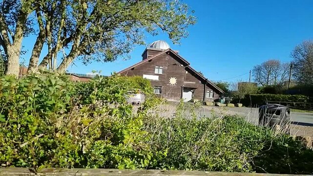 Slow motion establishing shot of Cronton observatory on top of Pex hill country park