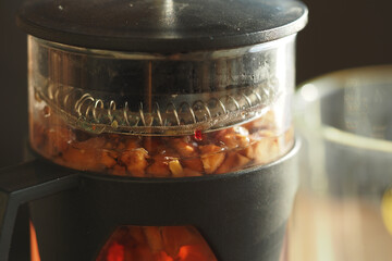 Brewing herbal infusion in a French press during morning hours