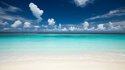 Fototapeta premium A beautiful blue ocean with a few clouds in the sky