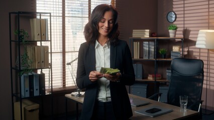 Caucasian woman counting money bills dollars salary cash checking smiling successful businesswoman satisfied worker employee office entrepreneur female girl wealth rich business reward inside manager