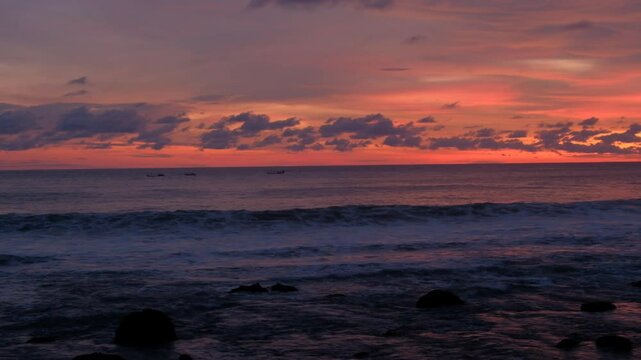 Sea horizon and scenic sunrise over splashing ocean waves and beach shore, tropical landscape 4K video