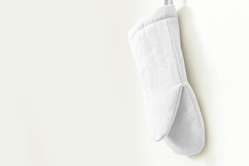 Oven mitt png mockup, white kitchen wall