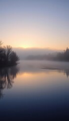 Obraz premium Sunrise mist shrouds tranquil river, peaceful dawn light reflects on calm water, reflection, mist, unwind
