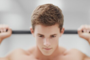 close-up of determined athlete lifting weights during intense crossfit session