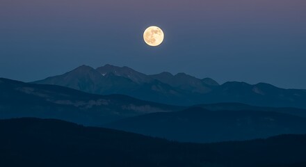 Fototapeta premium Serene Full Moon Over Silhouetted Mountain Range