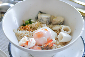 rice with soft boiled egg and seafood, seafood and rice