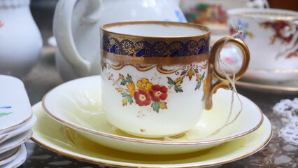 A beautifully patterned ceramic coffee cup in vintage antique style