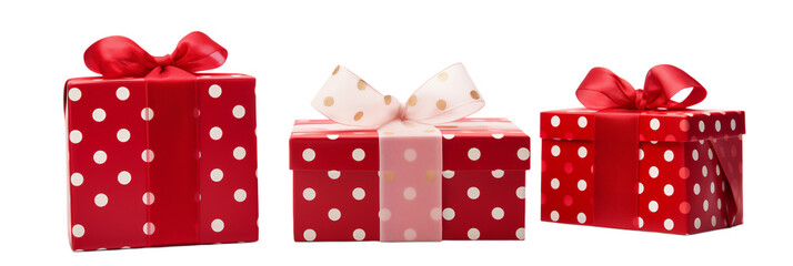 Obraz premium Three presents wrapped in red paper with white polka dots and ribbon bows displayed together png