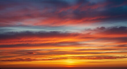 Naklejka premium Vibrant Sunset Sky - A breathtaking sunset with vivid orange, red, and purple hues painted across the sky. Perfect for backgrounds or nature themes