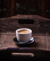 Cup of coffee on wooden background. Soft focus. Copy space