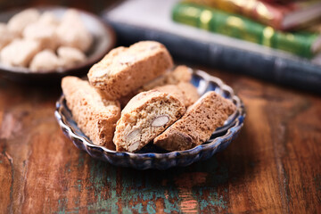 Cantuccini (Italian cookies) on dark wooden background. Close up	