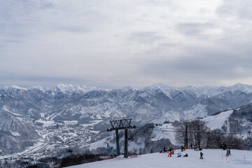 Snow mountains Yuzawa in Gala Yuzawa ski resort, view from Gondola rope lift, in winter season during snow falling, niigata Japan
