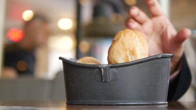 Freshly baked bread rolls in a cozy restaurant setting