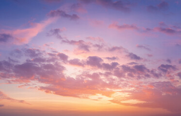 High-resolution image of a soft sunset sky with pastel pink, lavender, and gold tones. Gentle clouds and natural light glow. Dreamy and serene, suitable for beauty and wellness designs.