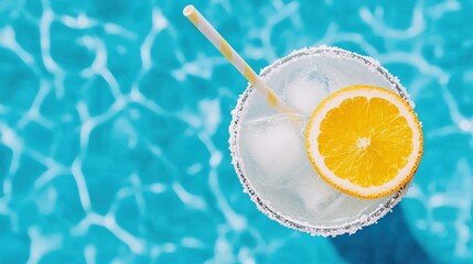Refreshing summer cocktail with crushed ice poolside beverage bright blue water top view chill vibe