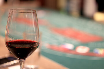 dinner in a restaurant with wine, beautiful table setting, a glass of wine in the foreground