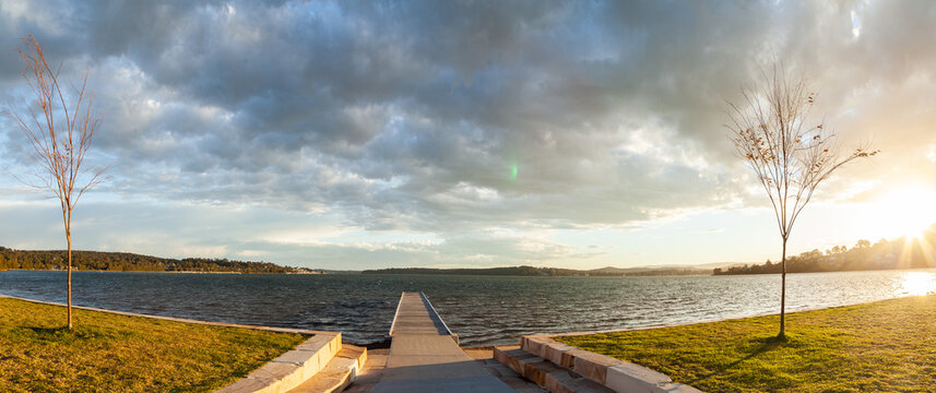 Looking out over jetty and sunlit water of Lake Macquarie at Warners Bay