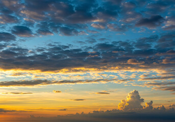 Fototapeta premium Dramatic Sunset Sky with Golden Cloudscape and Cumulus Clouds: Aerial View