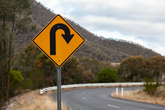 Sharp bend, turn in road sign on mountain road