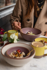 Stylish breakfast with muesli and coffee at café