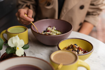 Fresh fruit muesli and drinks on marble table