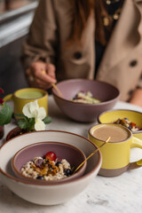 Stylish breakfast with muesli and coffee at café