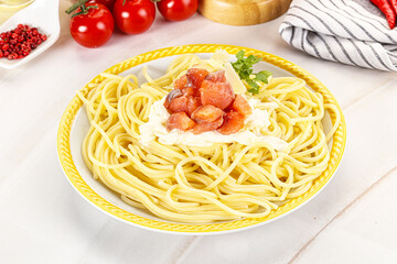 Pasta spaghetti with salmon and stracciatella