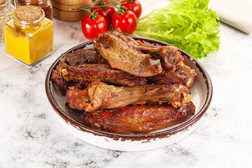 Roasted duck wings with sauce
