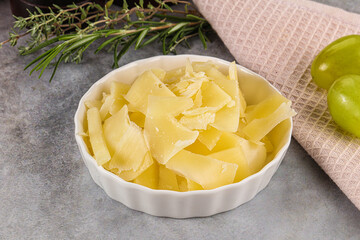 Parmesan cheese slices in the bowl