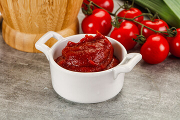 Red tomato paste in the bowl