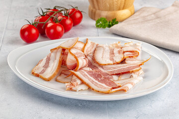 Raw pork tenferloin with bacon