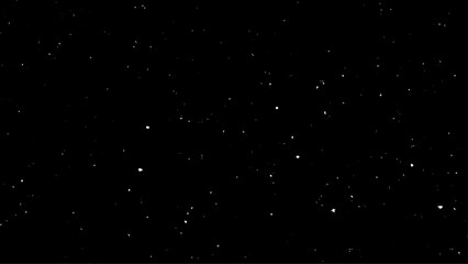 Flying dust particles on a black background. Real falling snow on a black background for use as a texture layer in a photo design. Snowfall on a black background