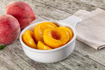 Sweet ripe yellow canned peaches