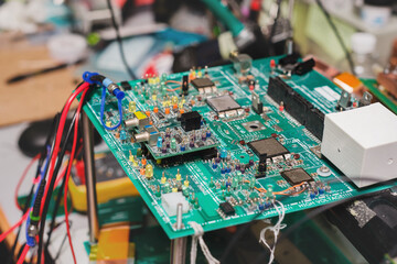 circuit board in messy workshop